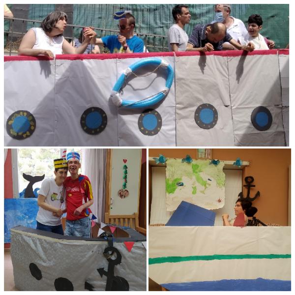 Residentes participando en la actividad de crucero virtual, llevando gorros de marinero y rodeados de cruceros hechos de telas y papel, en un ambiente creativo y divertido